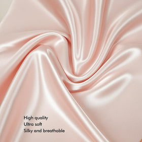 KISMETICS vegan silk sleep set on bed in light pink inviting restful ritual