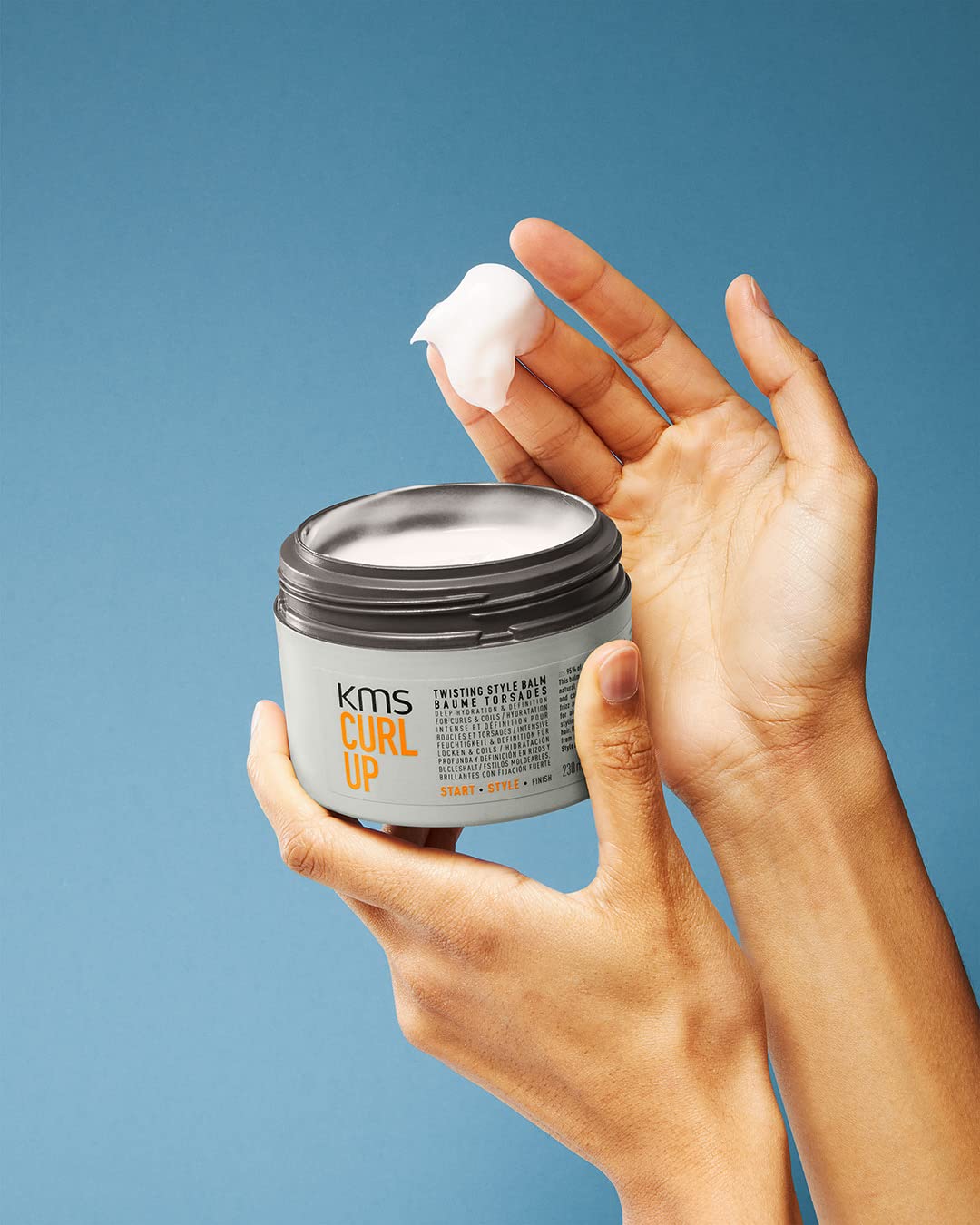 KMS CURLUP twist balm texture on hand reveals creamy moisture without heaviness