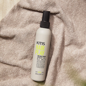 KMS Hairplay Sea Salt Spray on hair in motion for dynamic texture.