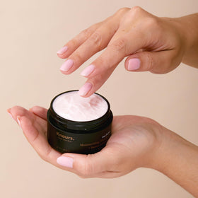 Knours One Perfect Youth Cream applied to fingertip for quick absorption.