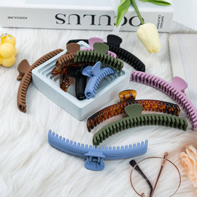 Koceci daily-use styling clip shown in bathroom setting for quick hair management.