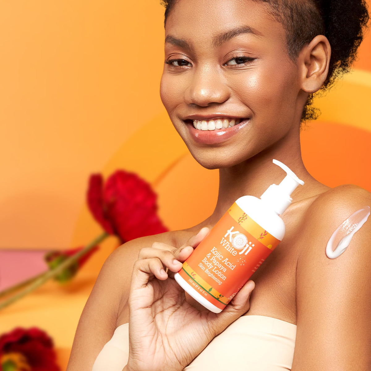 Koji White bottle against papaya background suggesting brightening routine.