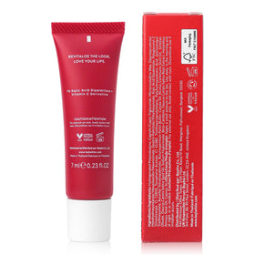 Koji White lip treatment on lips delivers a natural glossy finish.