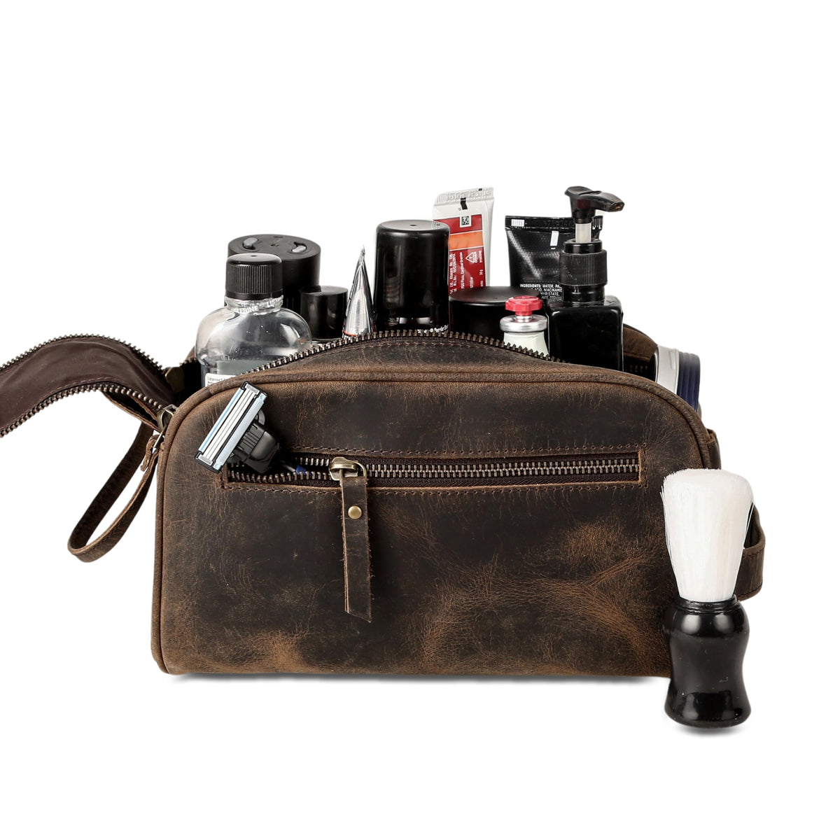 KomalC travel toiletry bag premium buffalo leather texture with detailed stitching.