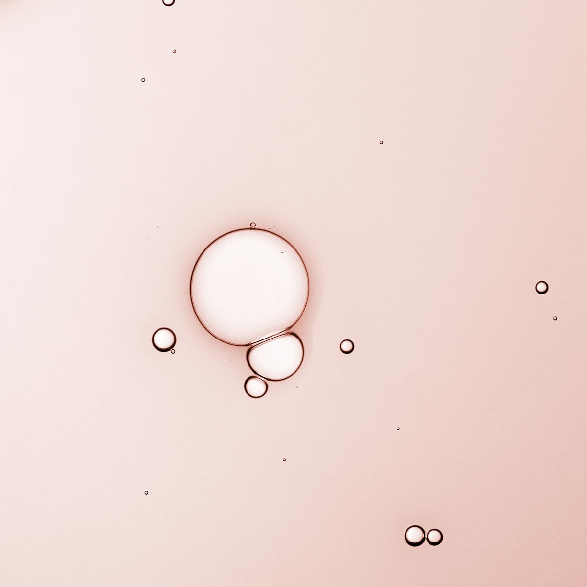 KORA Organics Turmeric Glow Drops dropper releasing serum for easy application.