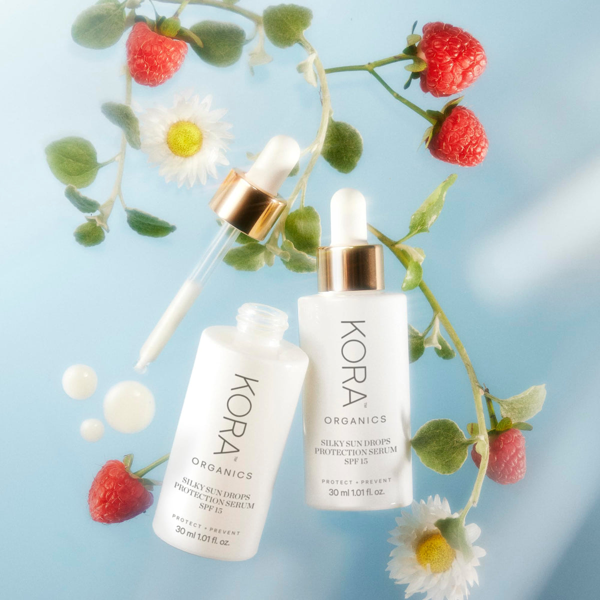 KORA Organics Silky Sun Drops being applied over makeup for mid-day reapplication