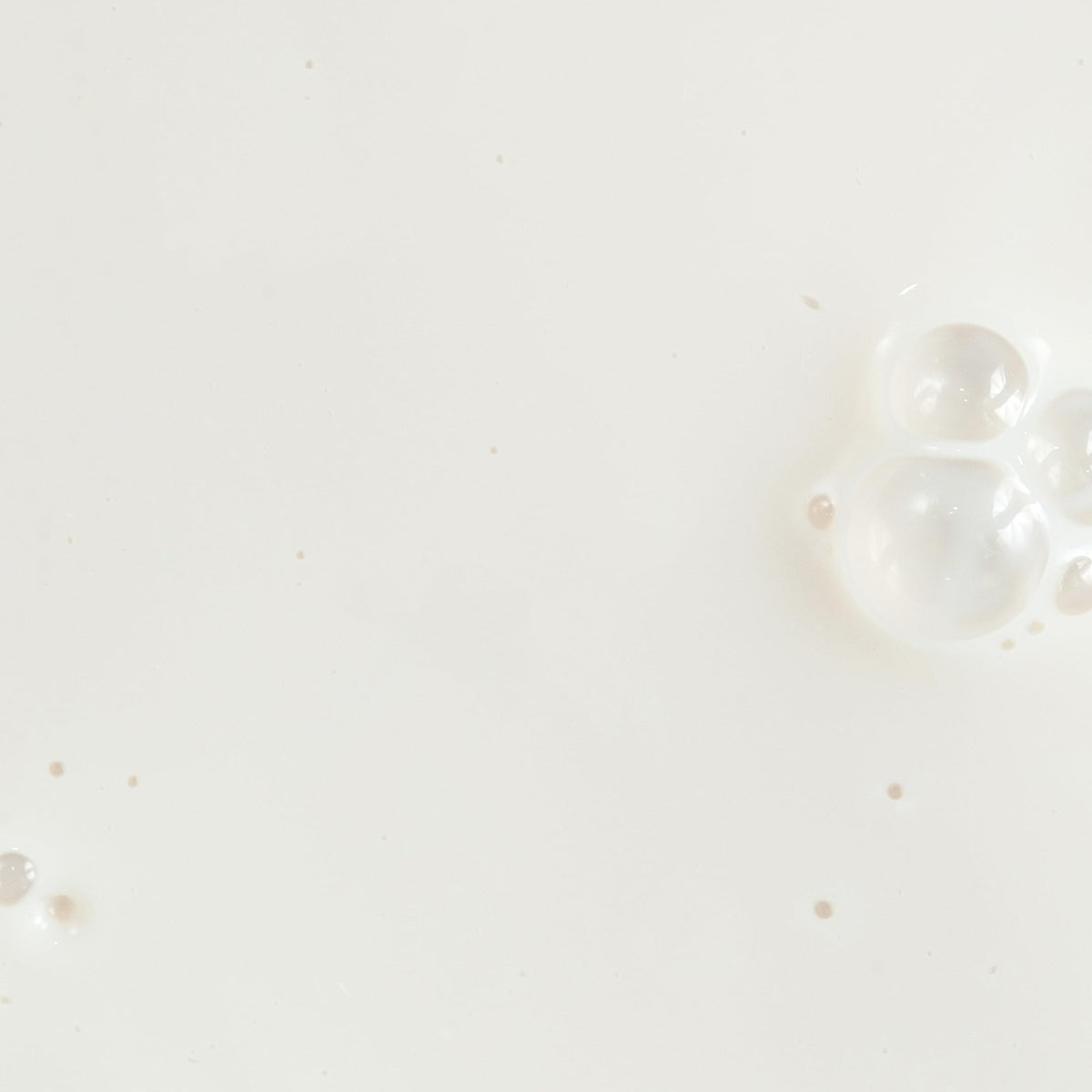 KORA Organics Silky Sun Drops serum texture close-up highlighting lightweight blendability