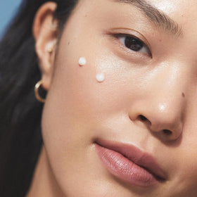 Travel-size packaging captured for on-the-go skincare routine.