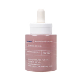 Korres Wild Rose Spotless Serum bottle on a clean vanity for radiant skin