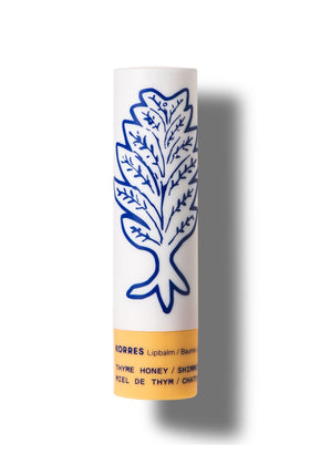 KORRES Lip Butter Stick Thyme Honey Shimmer provides a soft golden glow while keeping lips moisturized.