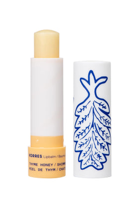 KORRES Lip Butter Stick Thyme Honey Shimmer twists up for on-the-go hydration and subtle glow.