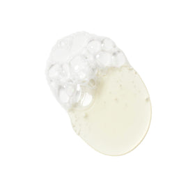 Massaging KORRES Olympus Tea Cleanser foam onto the face for a refreshing cleanse.
