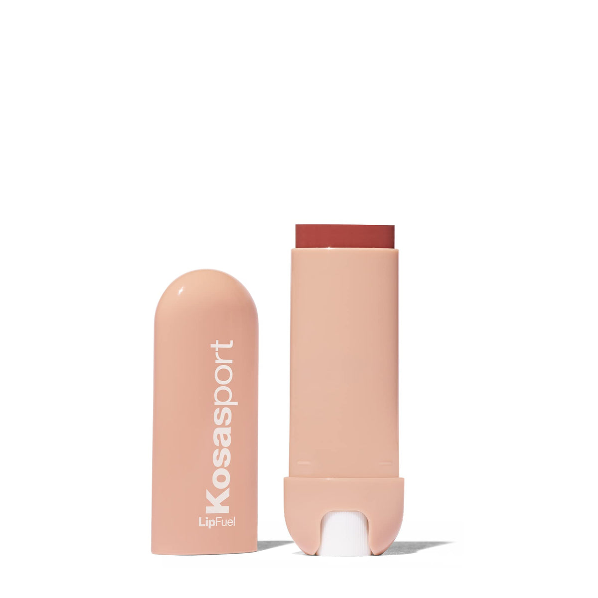 Kosas Lipfuel balm in pocket-ready form beside gym gear.