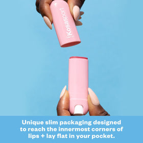 Kosas Lipfuel pink Rush tint gliding onto lips for subtle color.