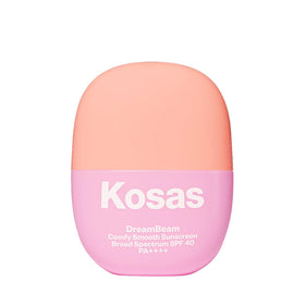 Kosas Mini DreamBeam SPF 40 bottle closeup, travel-friendly mineral sunscreen for on-the-go protection.