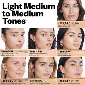 Kosas Revealer Concealer on the face for blemish coverage.