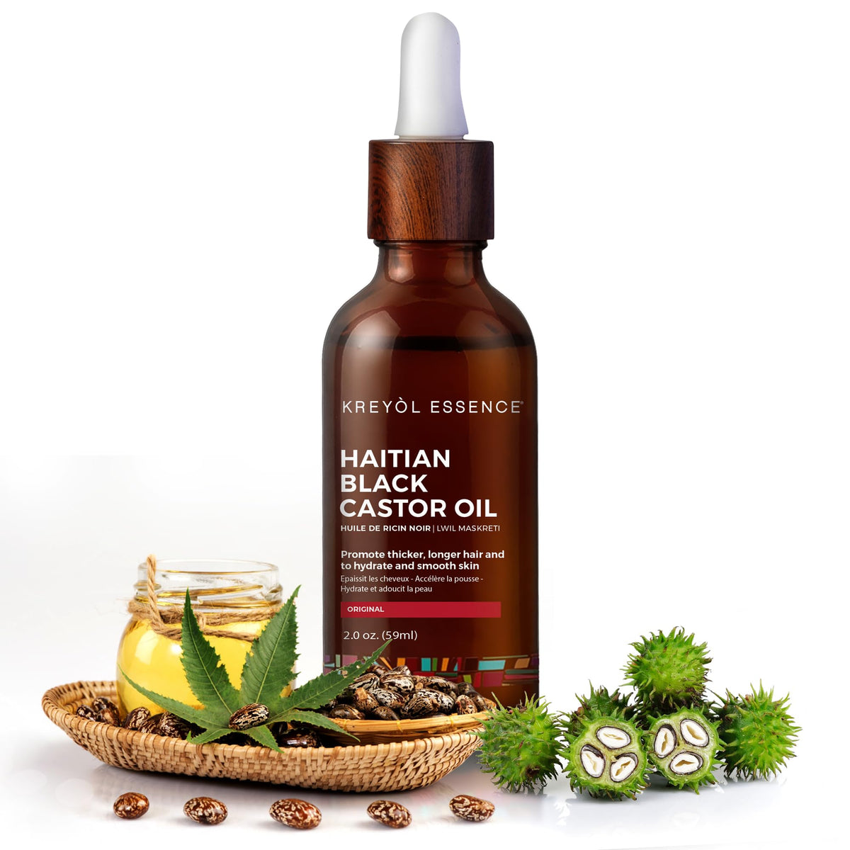 Kreyol Essence Haitian Black Castor Oil bottle close-up preparing for scalp moisturization.