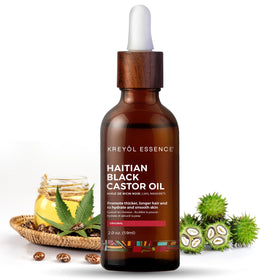 Kreyol Essence Haitian Black Castor Oil bottle close-up for pure hair and scalp care.