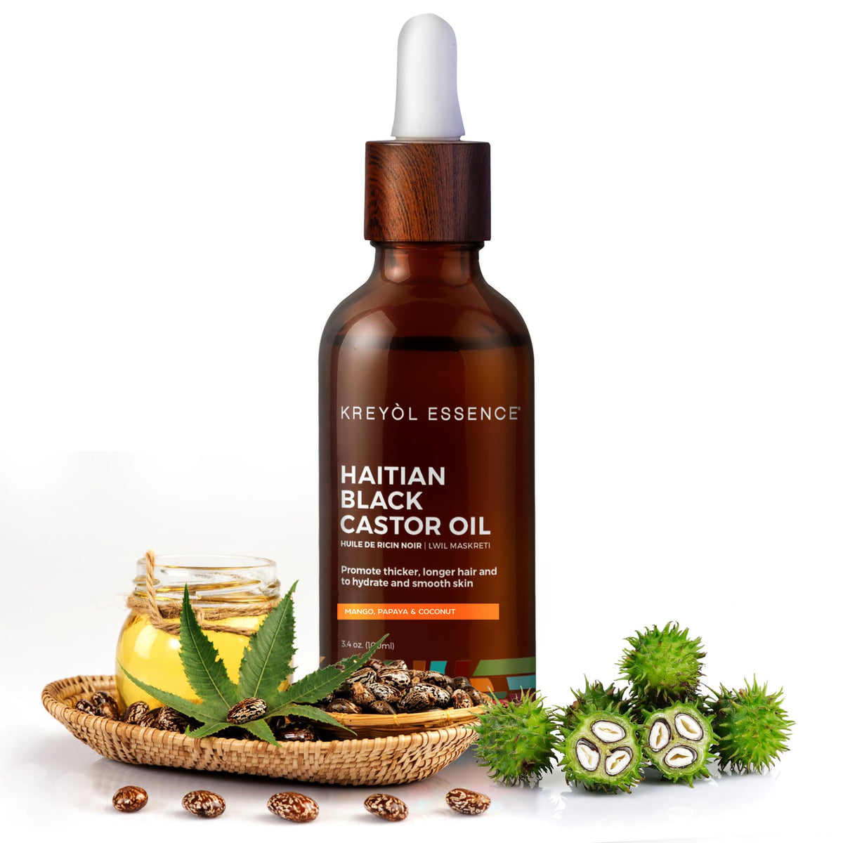 Kreyol Essence oil drops on hand ready for scalp or skin application.
