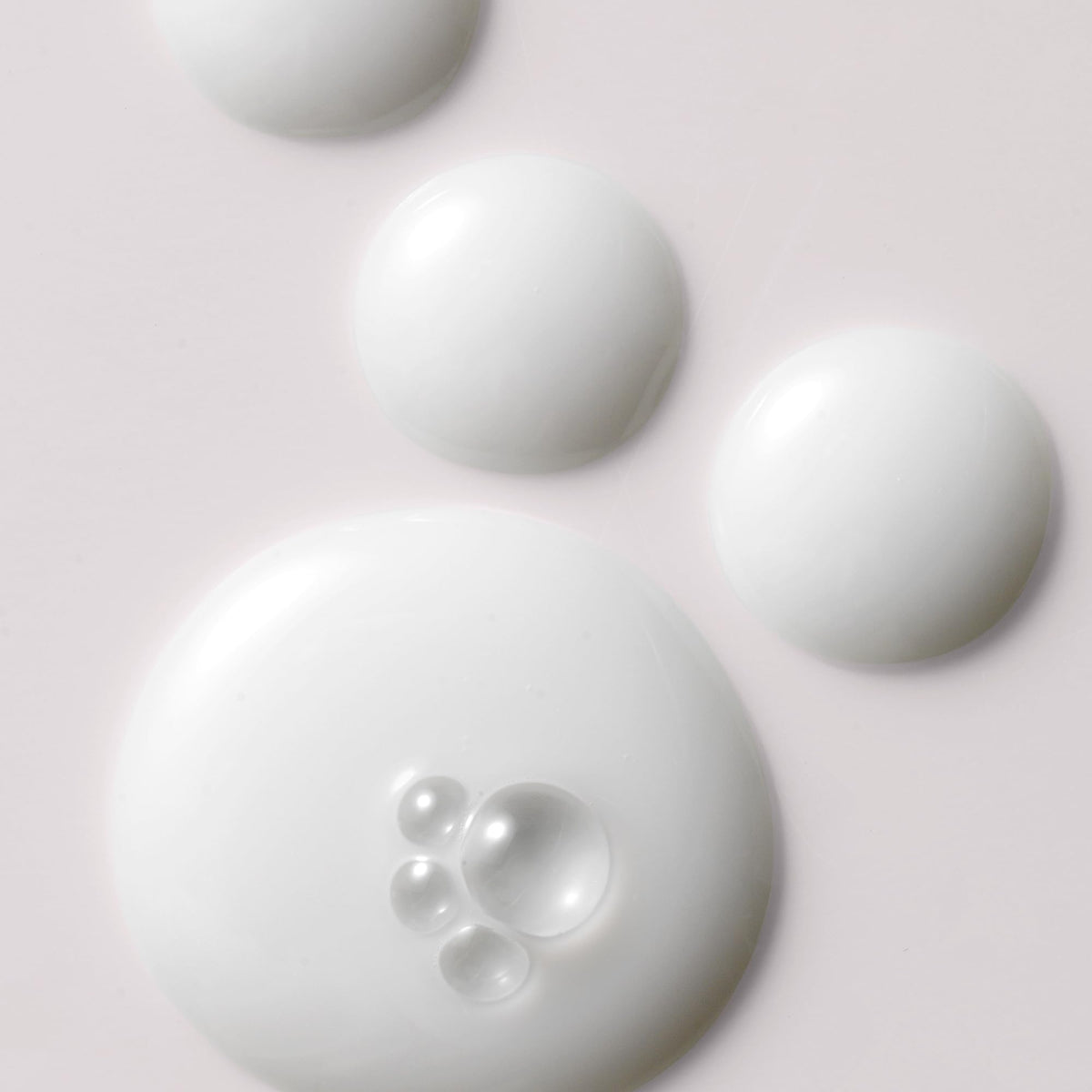 Kristin Ess Milk Oil dispenser in action for scalp nourishment