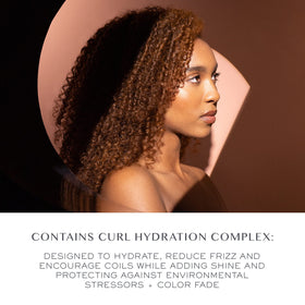 Kristin Ess Bouncy Curls packaging display highlights vegan, color-safe formula.