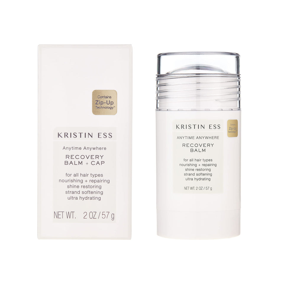 Kristin Ess Hair Recovery Balm Stick in use for moisture restoration.