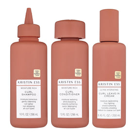 Kristin Ess Moisture Rich Curl Shampoo bottle delivering gentle cleanse and hydration for defined curls.