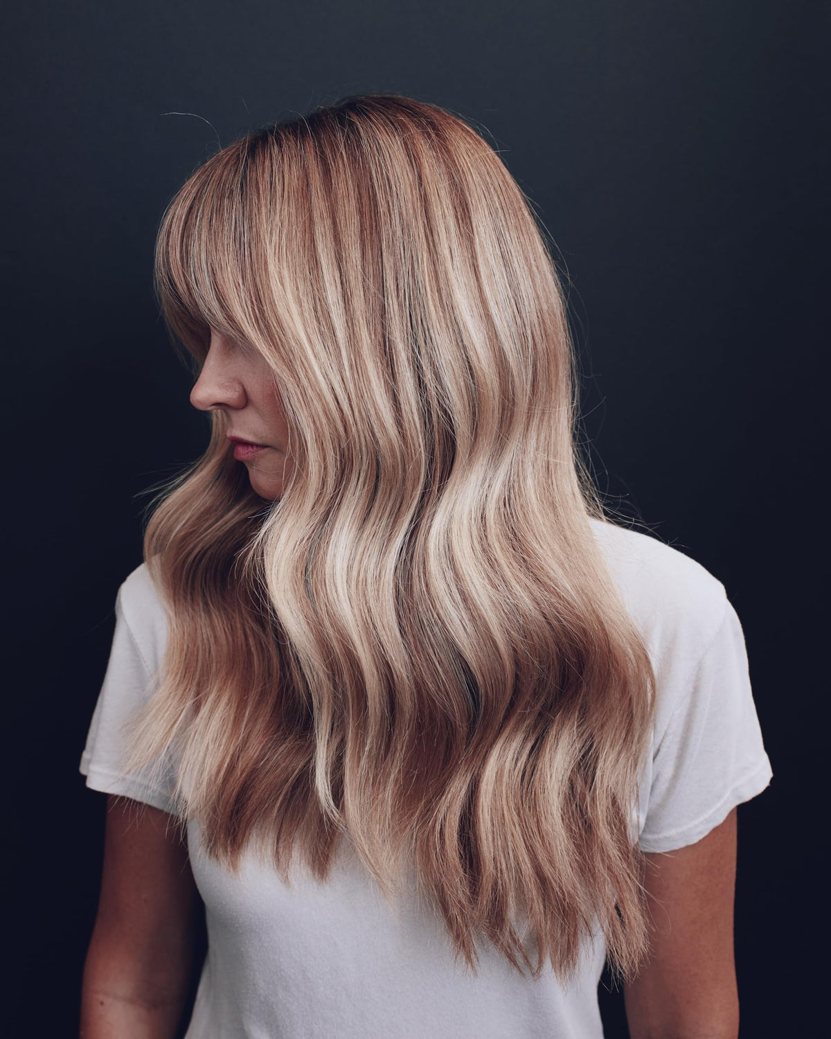 Shiny, vibrant blonde hair after using Kristin Ess Purple Conditioner.