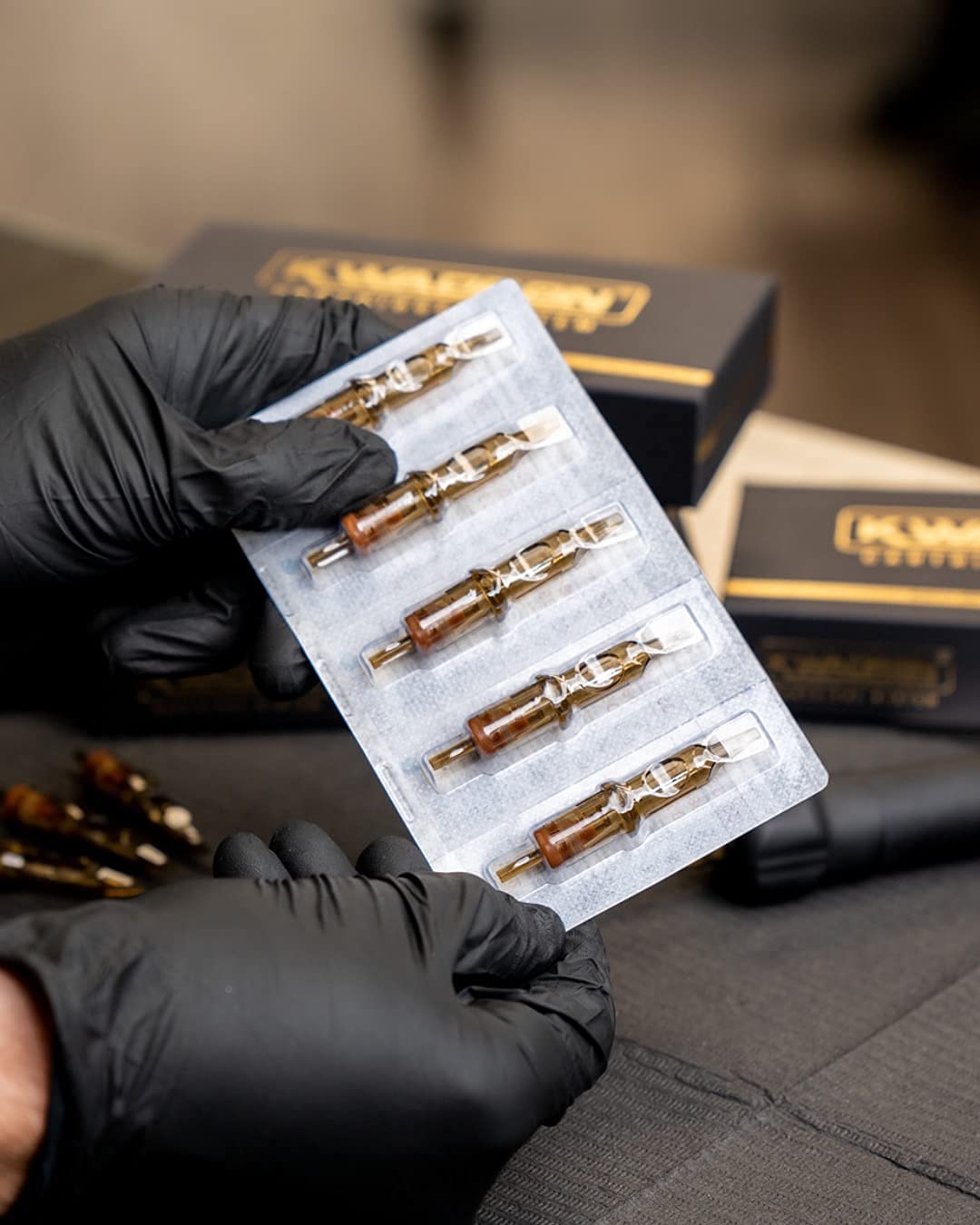 Kwadron studio setup shows reliable tattoo cartridge supply.
