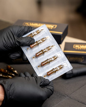 Kwadron studio setup shows reliable tattoo cartridge supply.