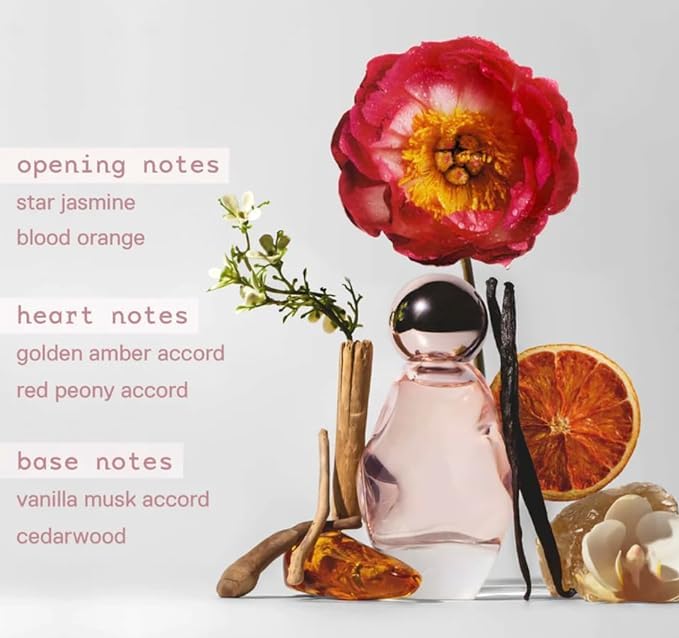 Kylie Cosmic pen spray nozzle close-up shows travel-friendly design for quick reapplication.