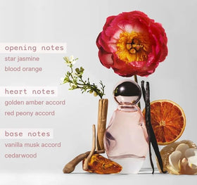Kylie Cosmic pen spray nozzle close-up shows travel-friendly design for quick reapplication.