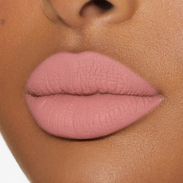 Kylie Koko K Lipstick swatch on lips showing pale pink shade.