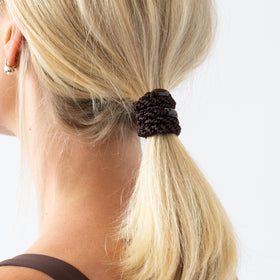 L. Erickson grab-and-go pony tube for quick, secure styling on the go.