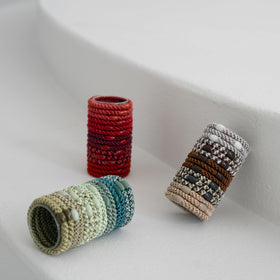 L. Erickson neutrals bead accents with matching tones.