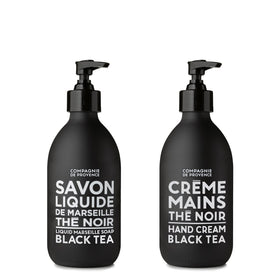 La Compagnie de Provence Black Tea liquid soap bottle on sink for refreshing cleansing.