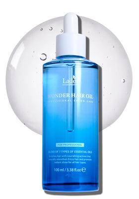 LA'DOR Wonder Hair Oil bottle pour demonstrates easy application and lightweight moisture.