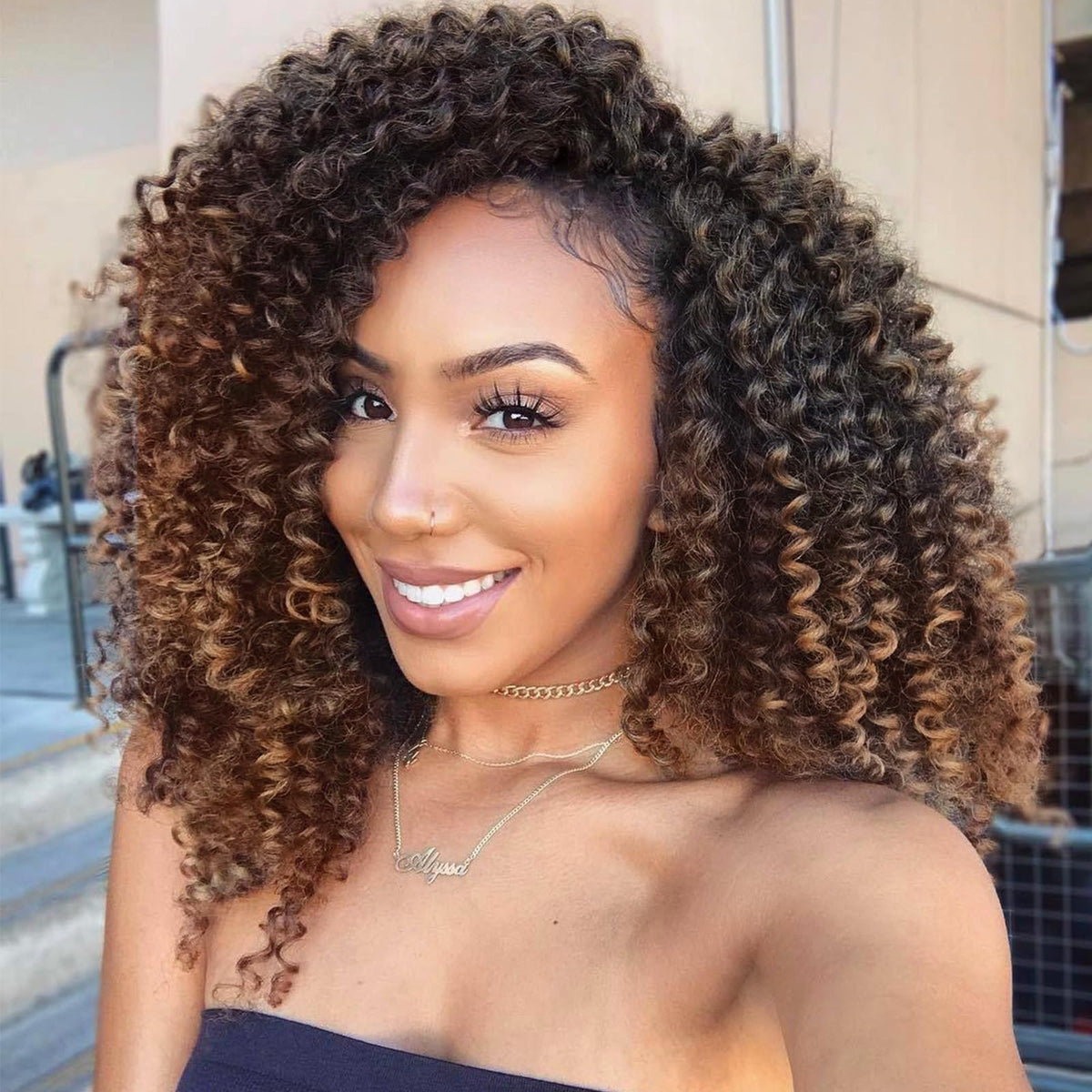 Lady Miranda afro kinky curly crochet hair in ombre brown close-up, natural texture