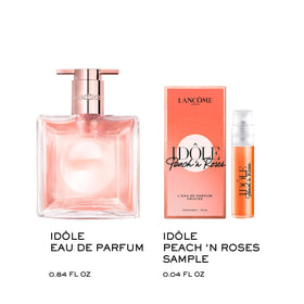 Lancôme Idôle bottle on a glass vanity with light catching finish.