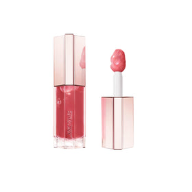 Lancôme Lip Idôle JuicyTreat bottle close-up highlighting hydrating gloss.