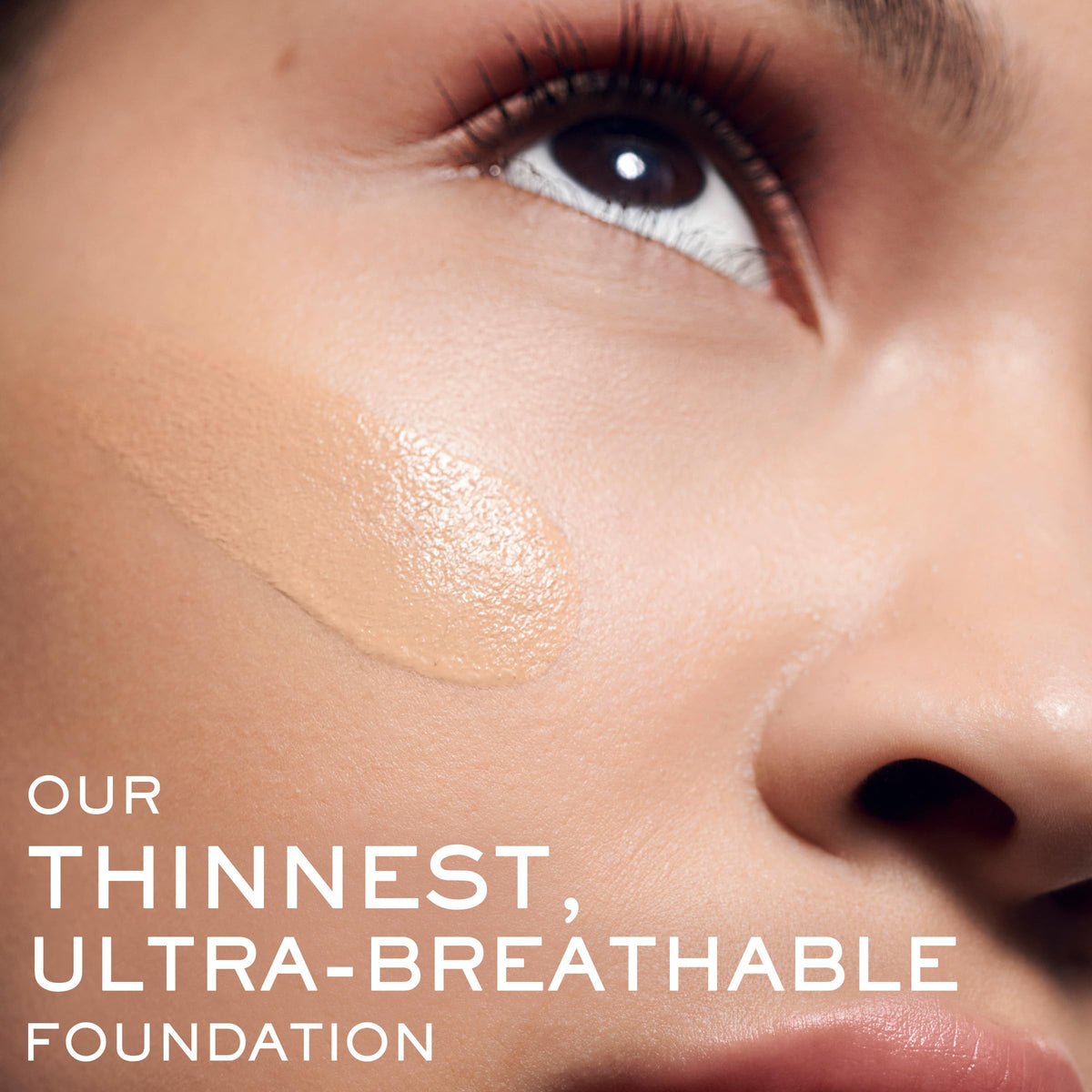 Lancôme Teint Idole Ultra Wear being applied with brush for even coverage.