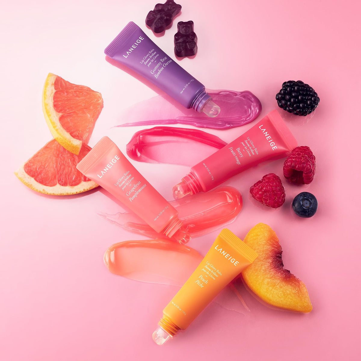 LANEIGE Lip Glowy Balm Peach tube on hand demonstrates compact design.