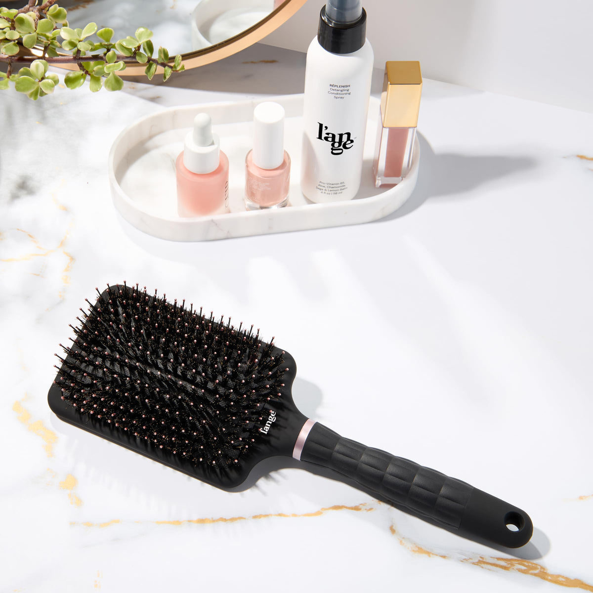L'ANGE HAIR Detangling Paddle Brush used on thick hair for faster detangling