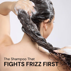 Bathroom setup featuring L’ANGE HAIR Frizz Care bottle for a lightweight smoothing routine.