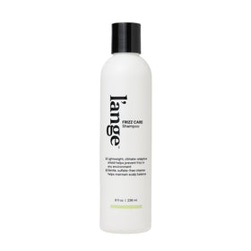 L’ANGE HAIR Frizz Care shampoo bottle shows smoothing formula for frizz control.