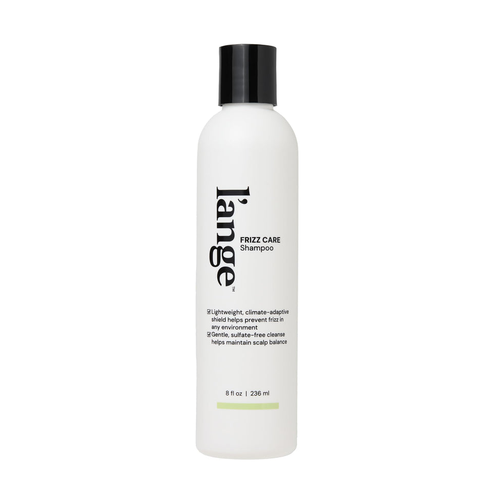 L’ANGE HAIR Frizz Care shampoo bottle shows smoothing formula for frizz control.