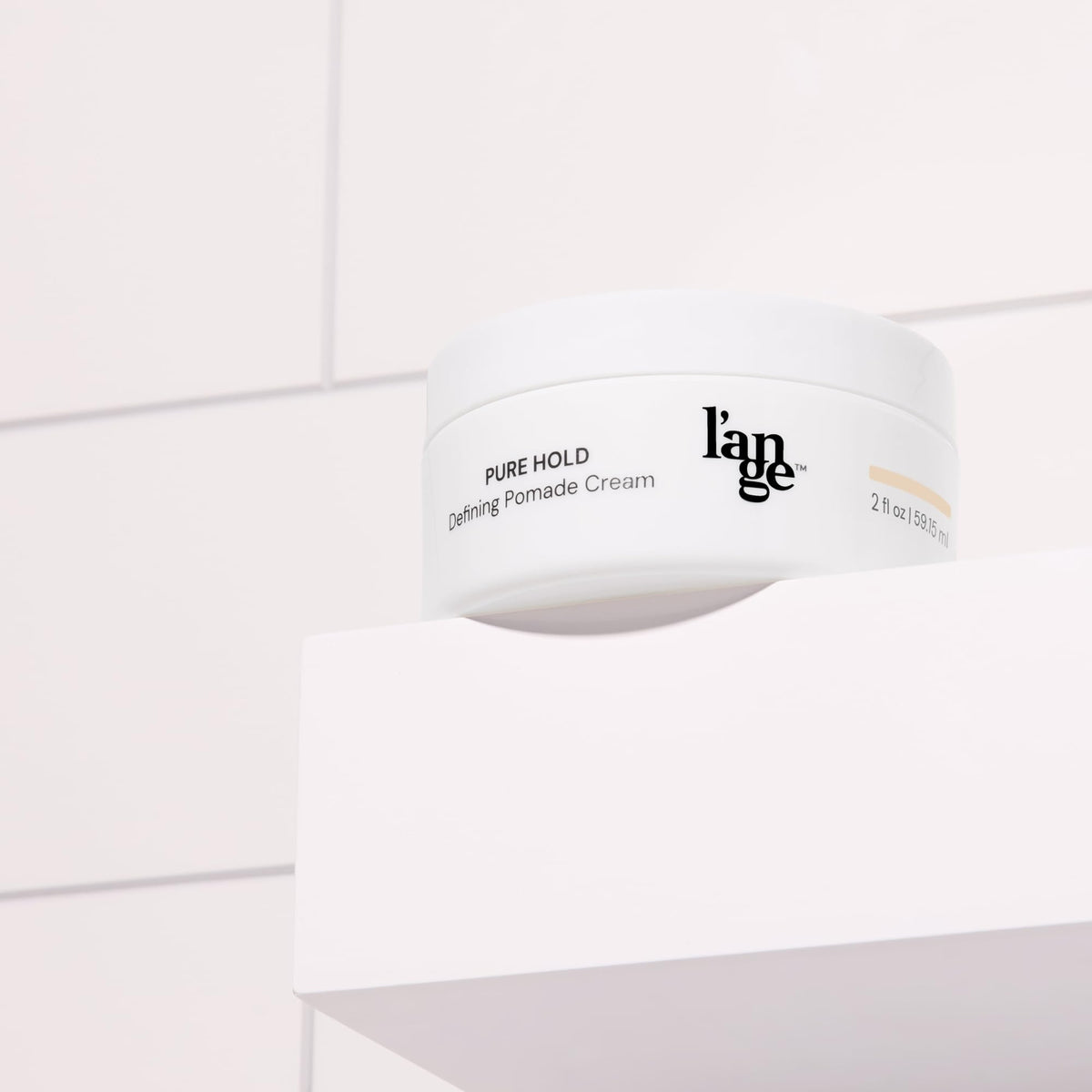 Pure Hold Defining Cream in use for touchable, non-greasy styling