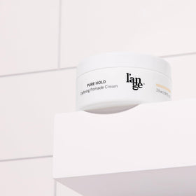Pure Hold Defining Cream in use for touchable, non-greasy styling