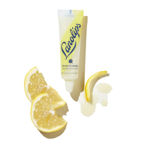 Lanolips Lemonaid Lip Treatment on lips with gentle lemon glow and gloss.