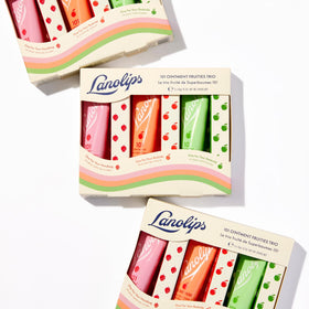 Lanolips strawberry tin open showing smooth ointment texture for hydration